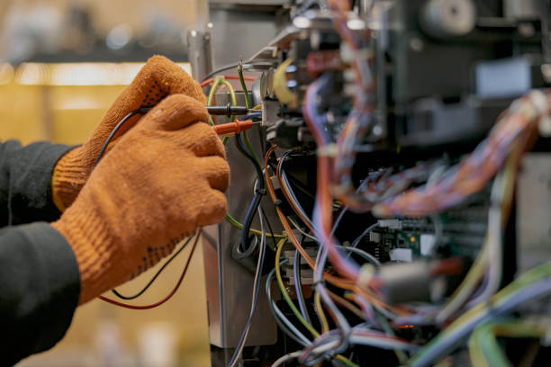 istock Male electrician hands repairing coffee machine in workshop 1400785389