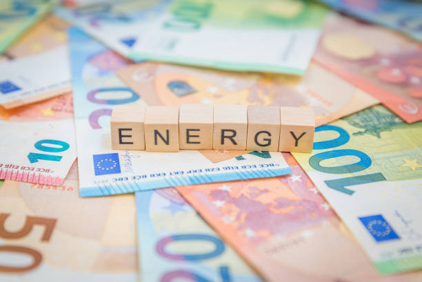 istock The word Energy written on banknotes Euro notes with wooden cube 1400785513