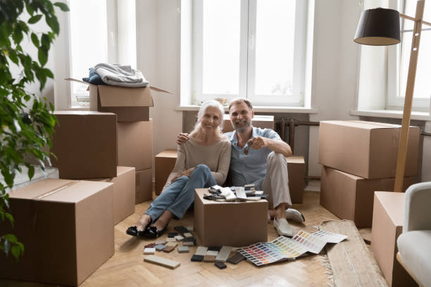 istock Happy older spouses showing keys from new house 1400788255