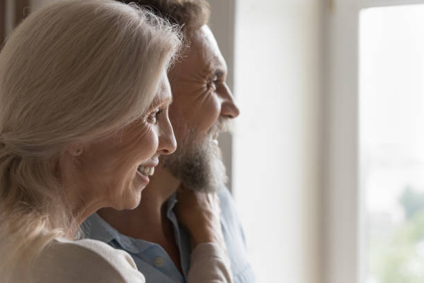 istock Closeup side profile faces of older spouses staring into distance 1400788256