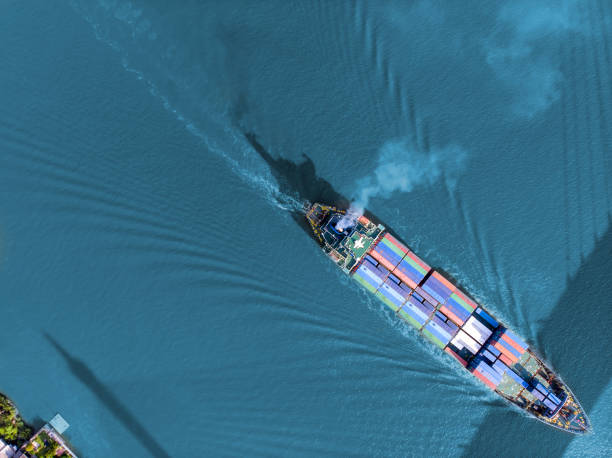 istock Cargo ship transporting shipment container arriving Bangkok port, drone aerial view. Freight transportation, import export business or industrial concept 1400789522
