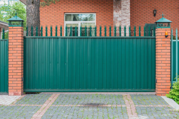 istock Metallic new gate by the house. 1400789551