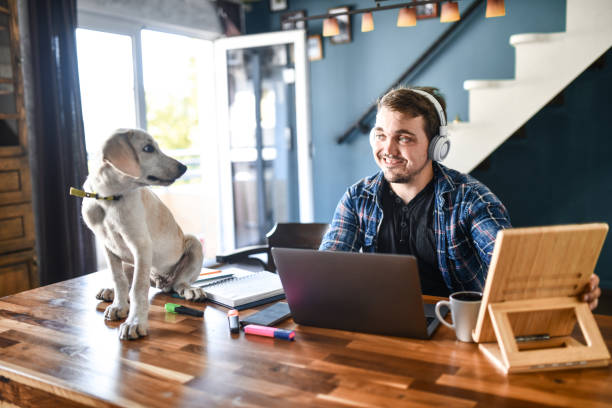 istock Smiling Freelancer With Dwarfism Sharing Loving Gaze With Pet Puppy 1400789750