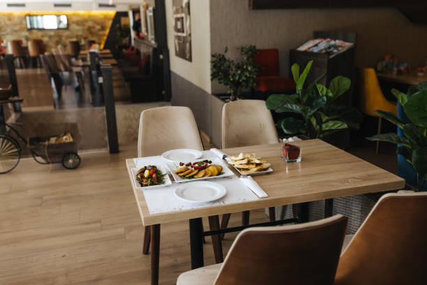 Table set with food for two in restaurant without people