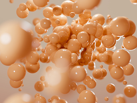 Renderizado 3D de bolas brillantes naranjas flotando alrededor. Composición abstracta de burbujas de colágeno o células madre photo