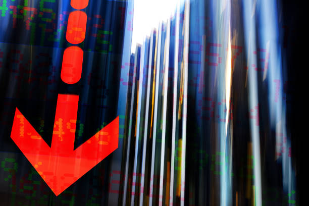 istock Finance. Arrow symbol. Blurred office buildings and Trading Screen Data. 1400792512