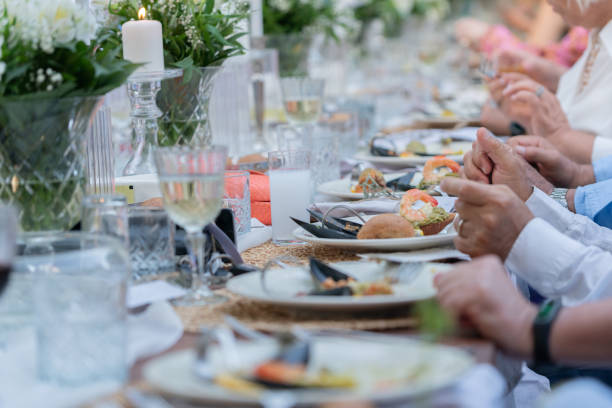 istock Close up senior friends having dinner party together 1400794057