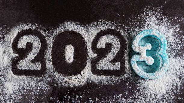 istock Numerals 2023 written with a stencil on scattered white flour 1400794094