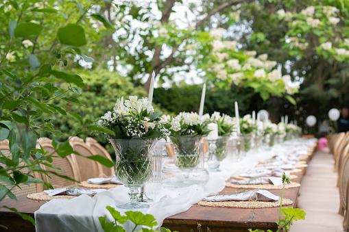 Wedding guest setup with fresh flowers in back yard