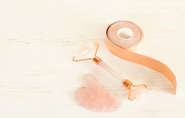 istock a roll of tapes, a roller and a scraper lie on a white wooden table 1400795648