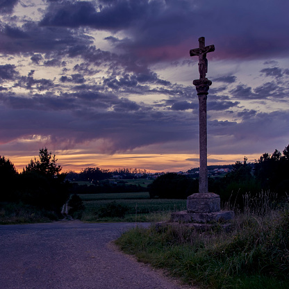 Stone cross in Muxia on the Camino de Santiago, Galicia, Spain. These symbols were built since the XVII century to sanctify the roads and pilgrims who walk to Santiago and other sacred Catholic places