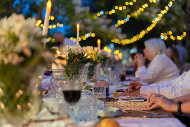 istock People with different ages and ethnicity having fun together at garden party. 1400799409