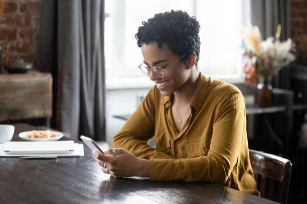 istock Happy cellphone user, woman in glasses watching media content 1400801127