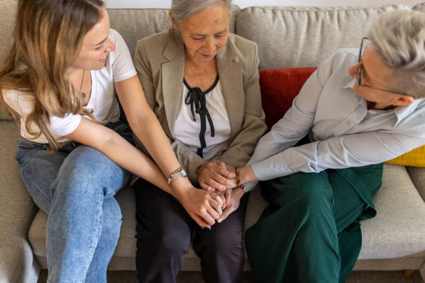 istock Caucasian multigenerational family holding hands and talking 1400801448