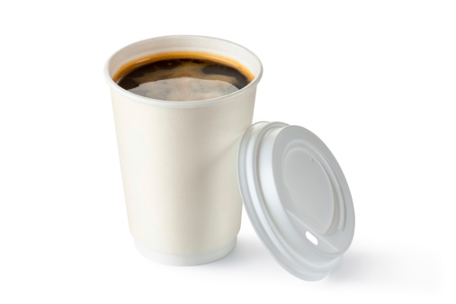 Coffee in opened disposable cup. Isolated on a white.