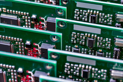 Closeup of Batch or Line of Ready ABS Automotive Printed Circuit Boards with Soldered Surface Mounted Components. Horizontal Shot