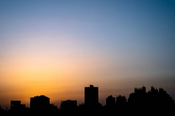 Zamalek dusk skyline Shot of Cairo skyline silhouette after dusk egypt horizon over land sun shadow stock pictures, royalty-free photos & images