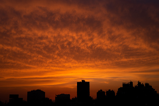 Red Clouds illuminated by the dusk light over Cairo Skyline viewed from Zamalek.