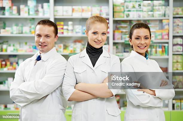 Pharmacy Chemist Team Women And Man In Drugstore Stock Photo - Download Image Now - Pharmacist, Pharmacy, Group Of People