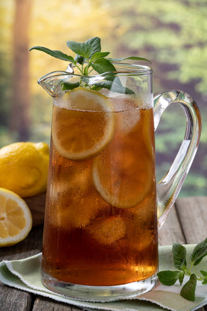 istock Pitcher of iced tea with ice lemon and mint 1400806581