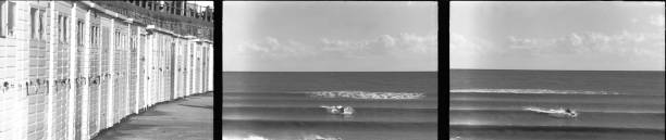 istock Beach huts and kayak surfers on the sea 1400808288