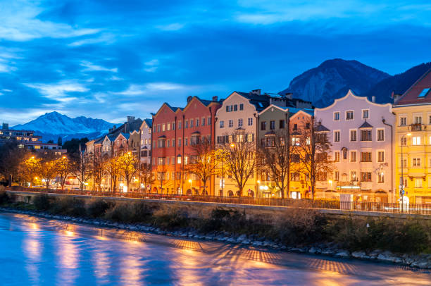 Innsbruck, Austria. Colorful houses by the river at dusk on October 17,2012. stock photo