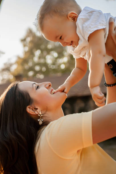 istock Mother playing with her son at the park 1400810189