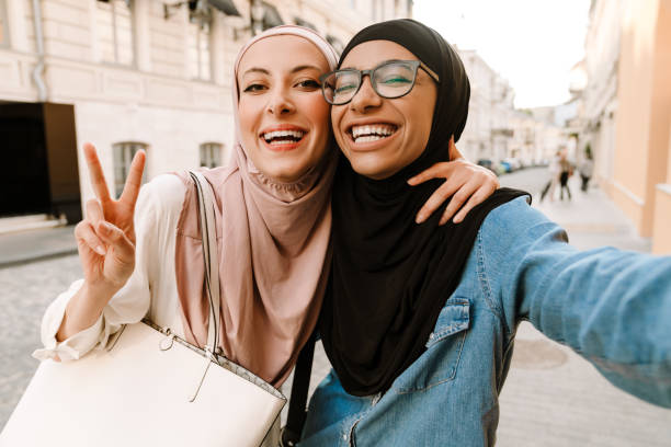 istock Two smiling mid aged islamic women 1400820134