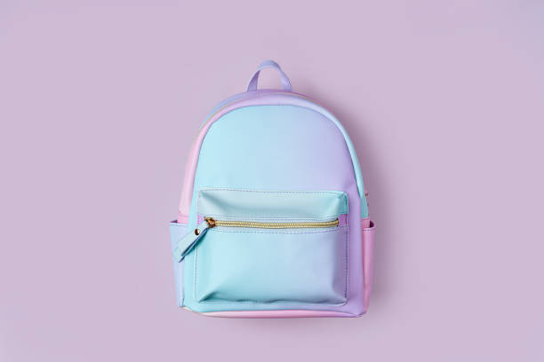 istock School backpack in pastel color on pink background. Concept back to school. 1400820305