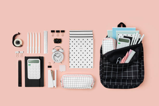 istock Opened School backpack with stationery  on pink background. Concept back to school. School supplies. 1400820367