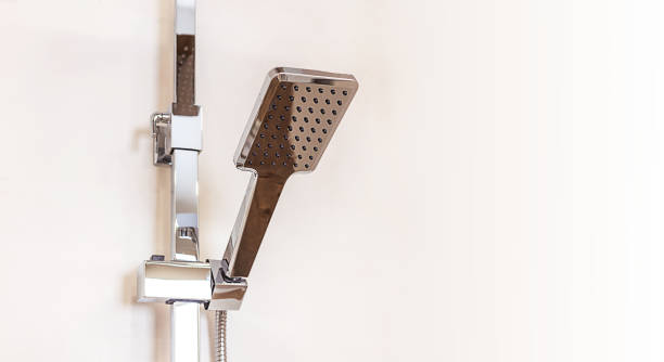 istock chrome-plated rain shower close-up hanging on wall, copy paste space for design 1400827434