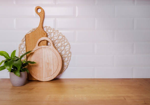 istock Beautiful boards for cutting meat on a white wall background, mockup 1400827932
