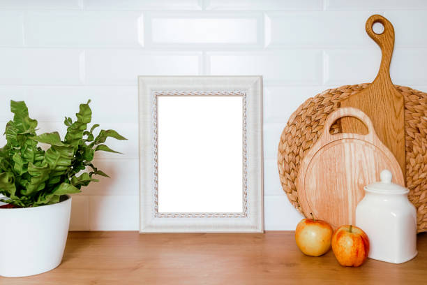 istock mockup in vintage style with a beautiful frame, kitchen utensils on a wooden table 1400827959