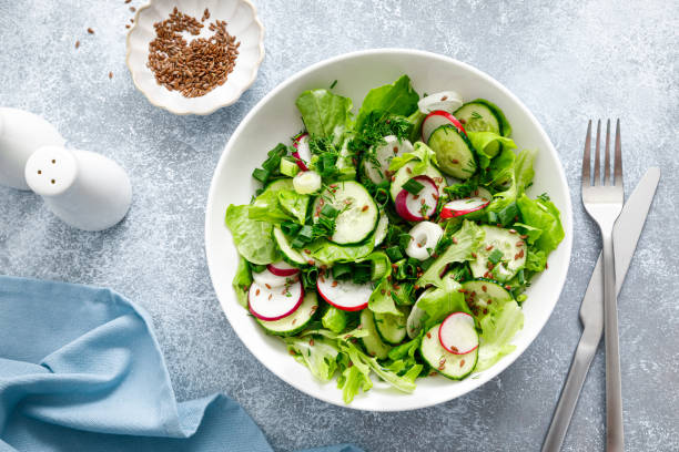 istock Salad with fresh green lettuce, radish and cucumber 1400832021