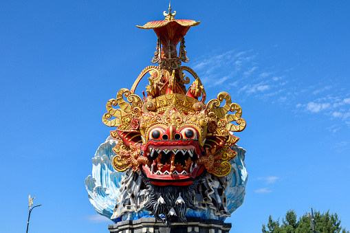 Hindu religious statue in Bali.  barong statue with blue sky background