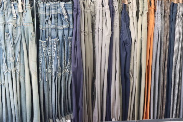 trousers of various colors displayed for sale