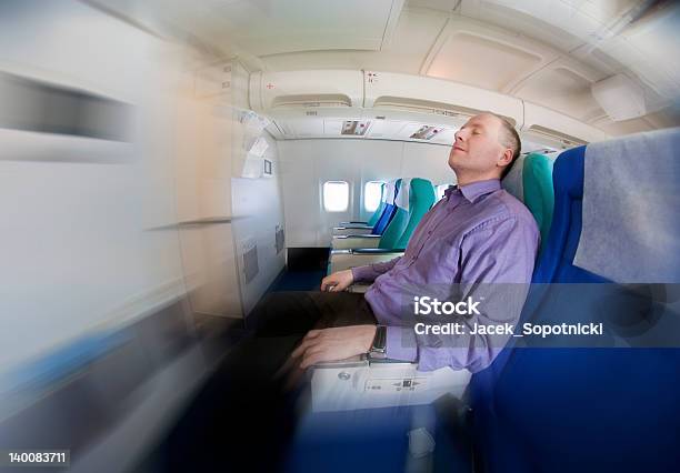 Businessman Resting On A Airplane Stock Photo - Download Image Now - Adult, Adults Only, Air Vehicle