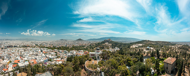 Aerial panoramic photo of Athens Historical Center - Acropolis of Athens, Monastiraki, Thisio, Ancient Agora, pedestrian streets, parks, lycabetus hill and the hill of Filopappou - Greece