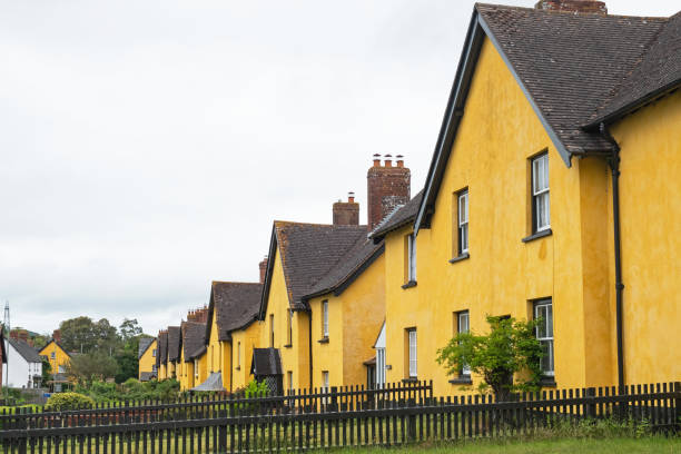 A row of vividly painted houses in an East Devon village