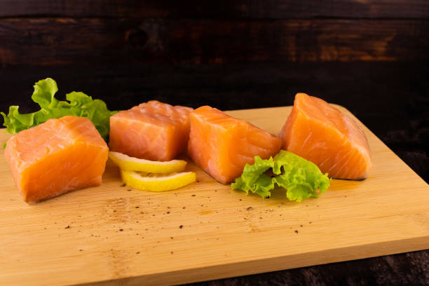 istock Four pieces of salmon with greens 1400840967
