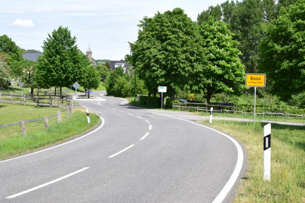 istock country road into Eifel village 1400842546