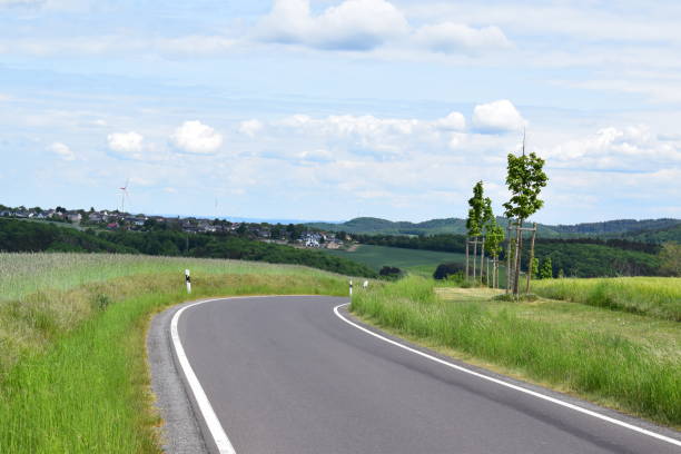 istock curvy narrow country road 1400842717