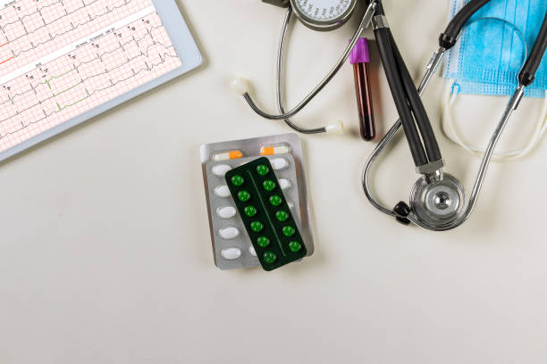 istock Doctor using digital tablet find information patient electrocardiogram viewed at the medical hospital a stethoscope 1400843393