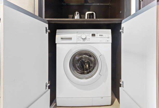 istock Clothes washing machine in room interior 1400847184