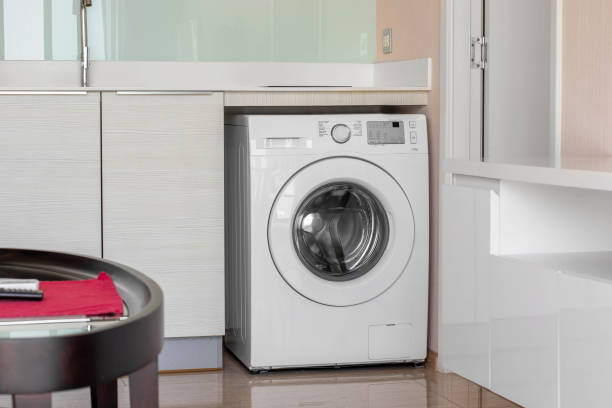 istock Clothes washing machine in room interior 1400847420