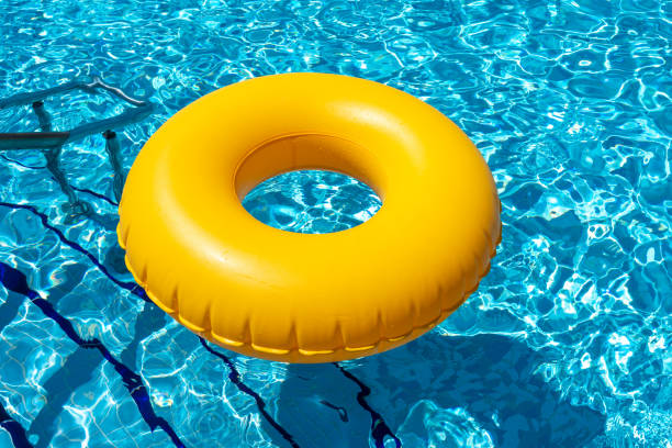 istock Yellow ring floating in refreshing blue swimming pool 1400853572