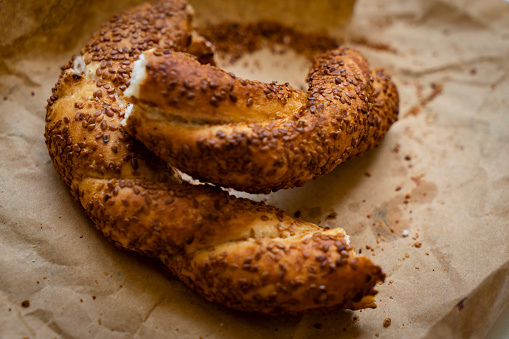 Turkish crispy bagel with sesame seeds on brown wrapping paper