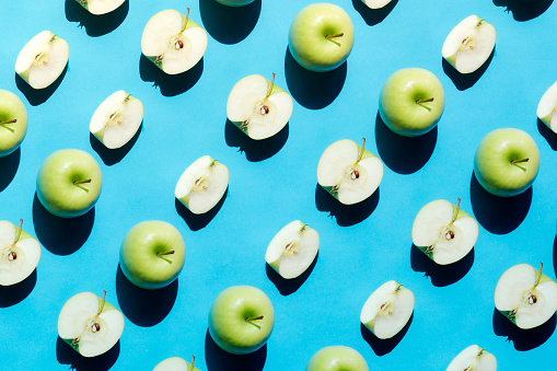 Green Apple Pattern on Blue Background