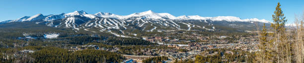 Panorama of Breckenridge, Colorado with ski trails on surrounding Rocky Mountains Panorama of Breckenridge, Colorado with ski trails on surrounding Rocky Mountains summit county stock pictures, royalty-free photos & images