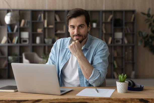 istock Young man professional expert freelancer do remote job at workplace 1400864416